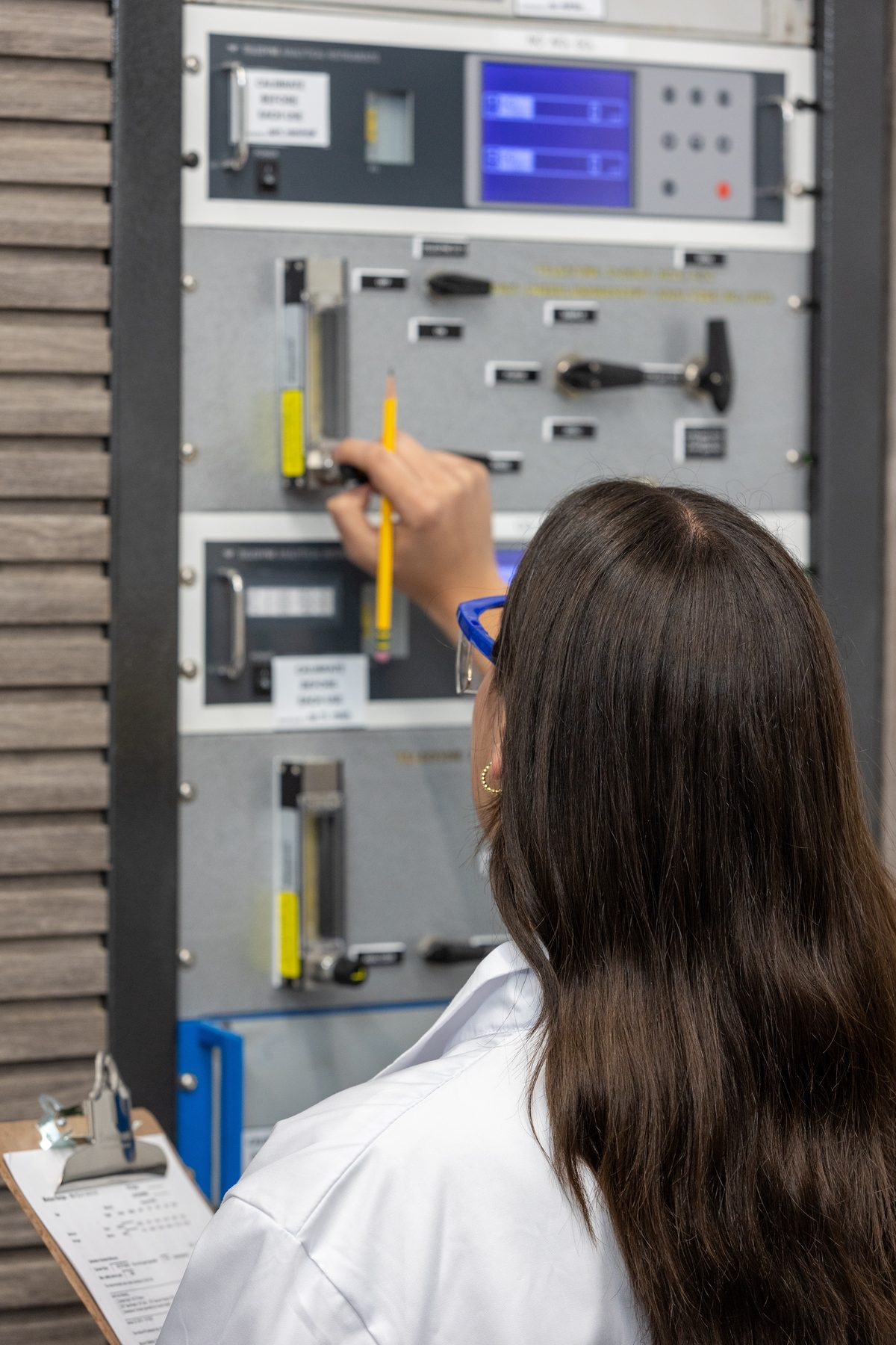 WSM quality control — technician reviewing certified gas analysis data